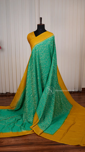 Crepe Georgette Saree With All-Over Floral Design And Elegant Zari Border Concept