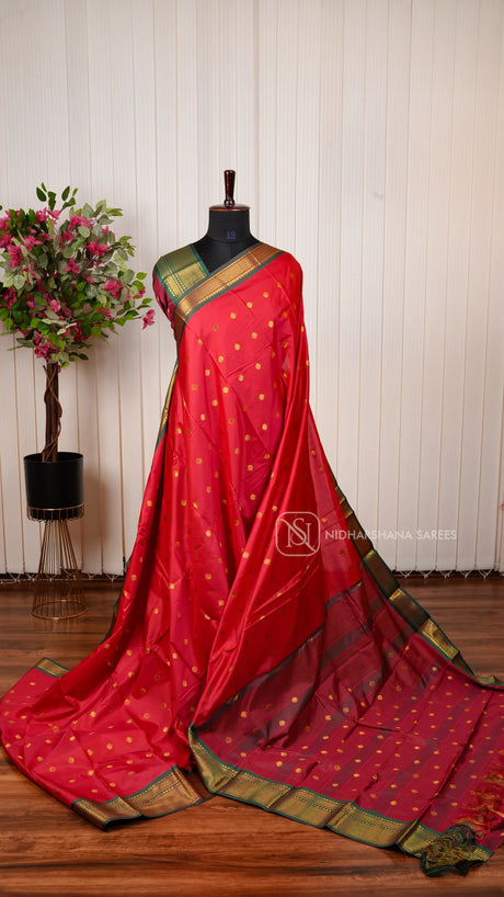 Semi Soft Silk Saree with Traditional Zari Motifs and Contrast Green Border
