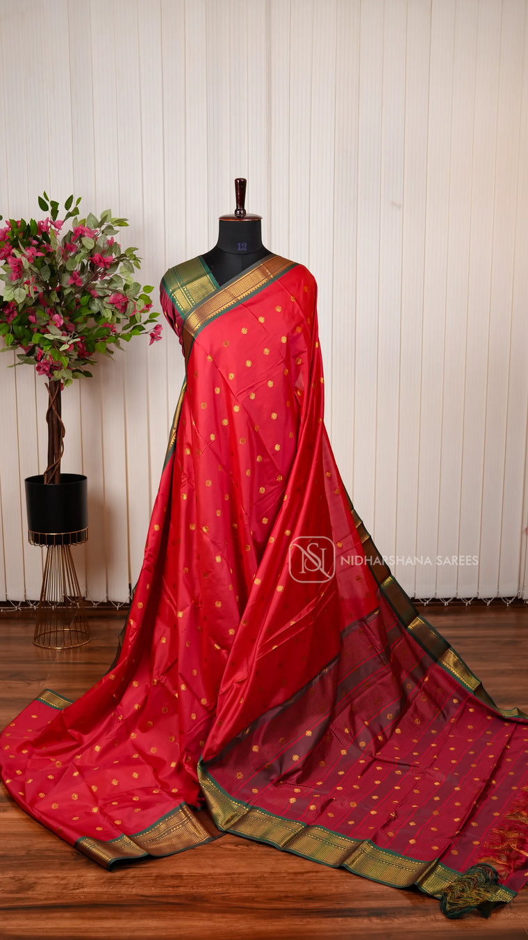 Semi Soft Silk Saree with Traditional Zari Motifs and Contrast Green Border