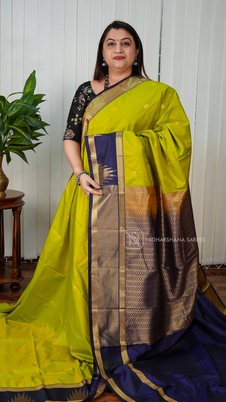Semi Kanchipuram Silk With Zari Peacock Butta And Gap Style Border