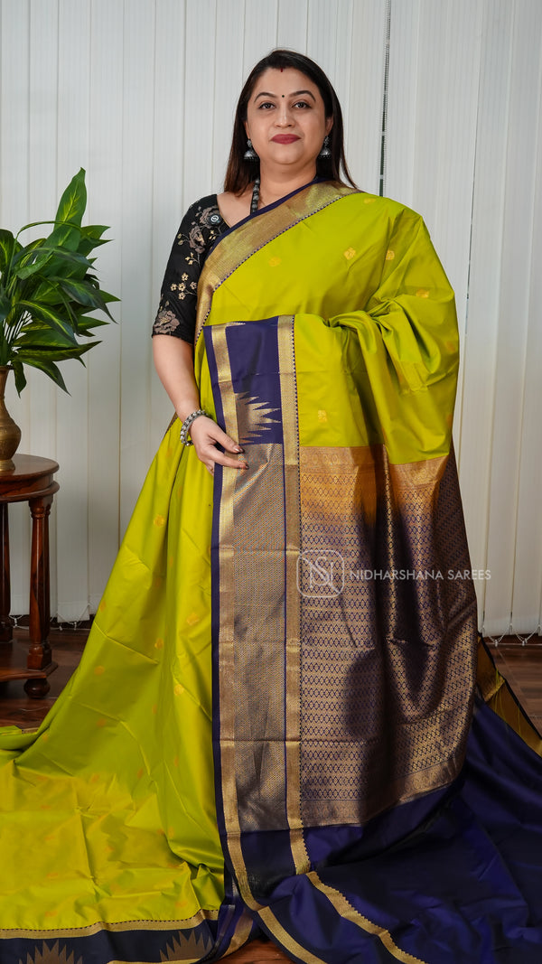 Semi Kanchipuram Silk With Zari Peacock Butta And Gap Style Border
