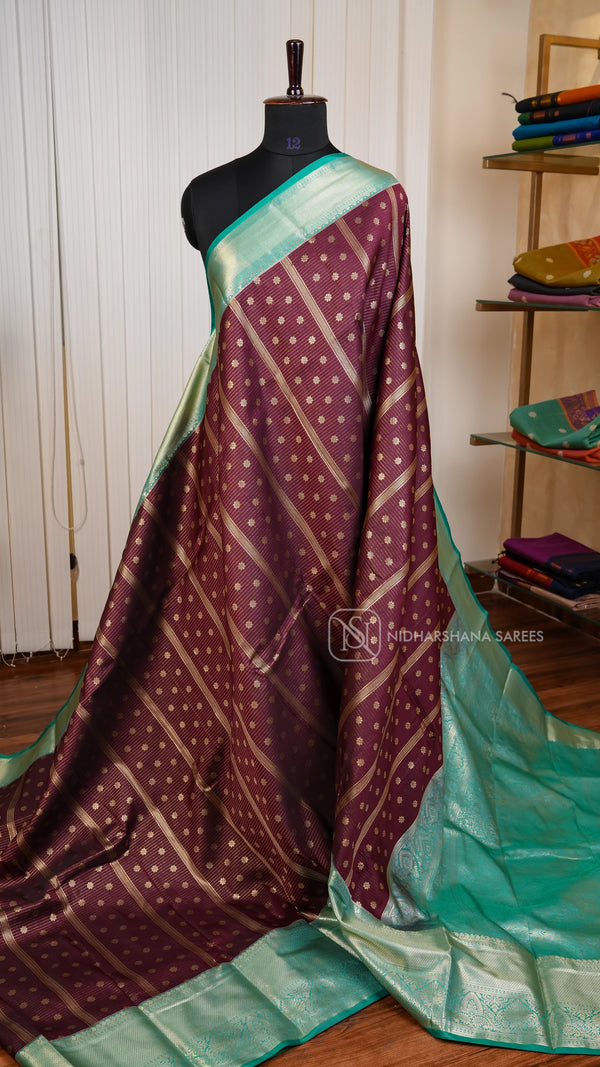 Semi Kanchipuram Silk With Floral Zari Butta Weaving And Contrast Zari Border