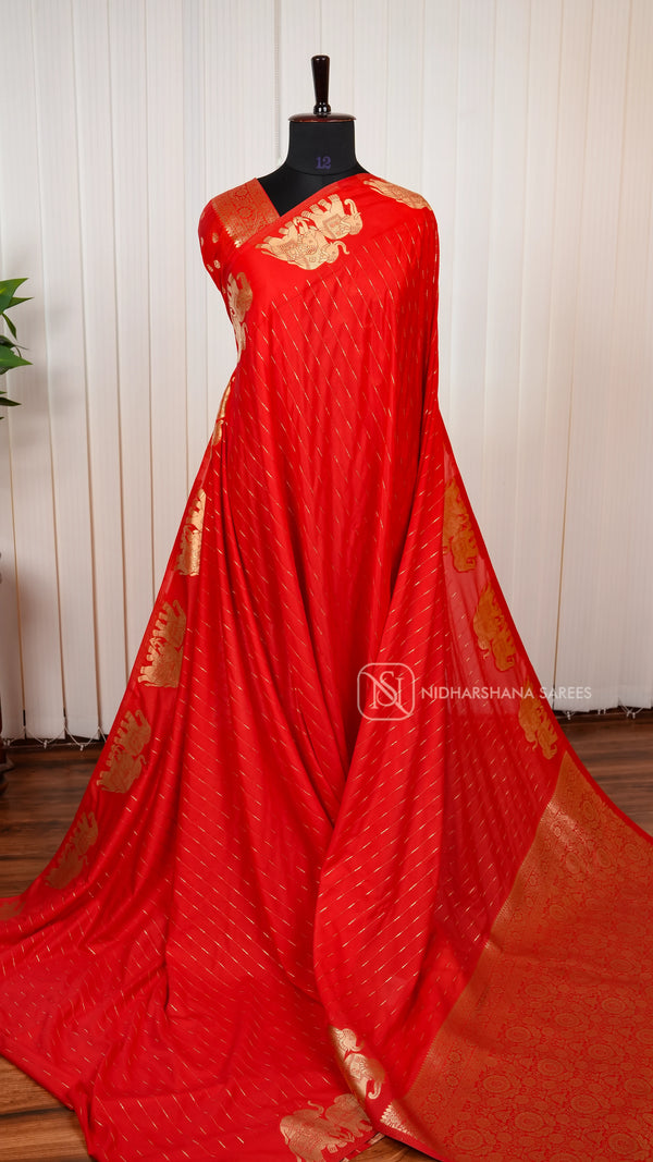 Viscose Crepe With Golden Zari Lines And Elephant Border