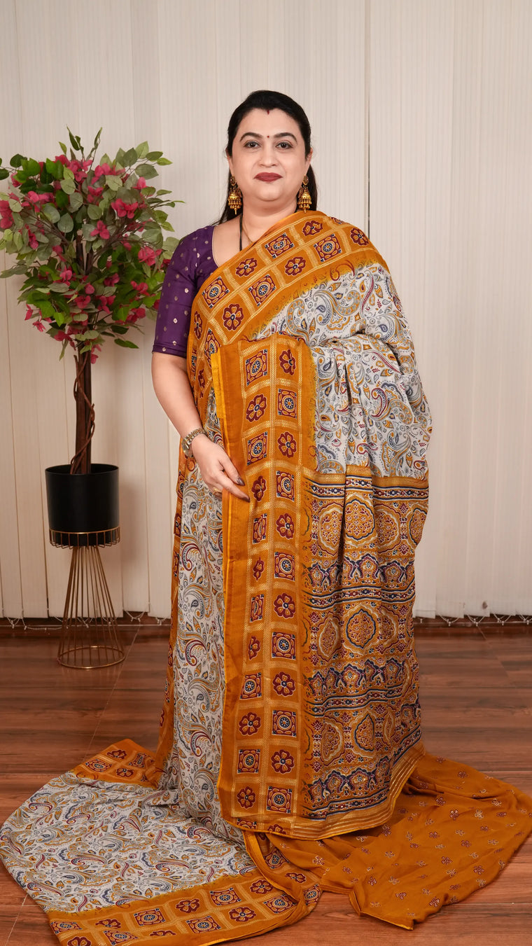 Semi Georgette With Gharchola Pattern Borders And Foil Printed Concept