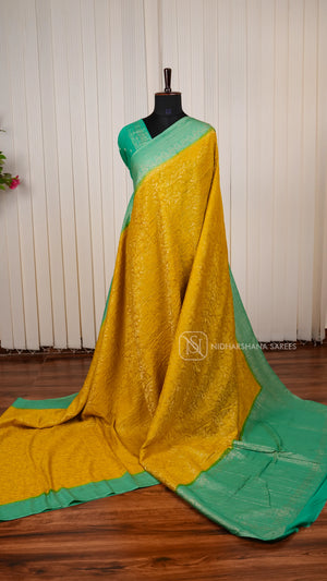 Crepe Georgette Saree With All-Over Floral Design And Elegant Zari Border Concept