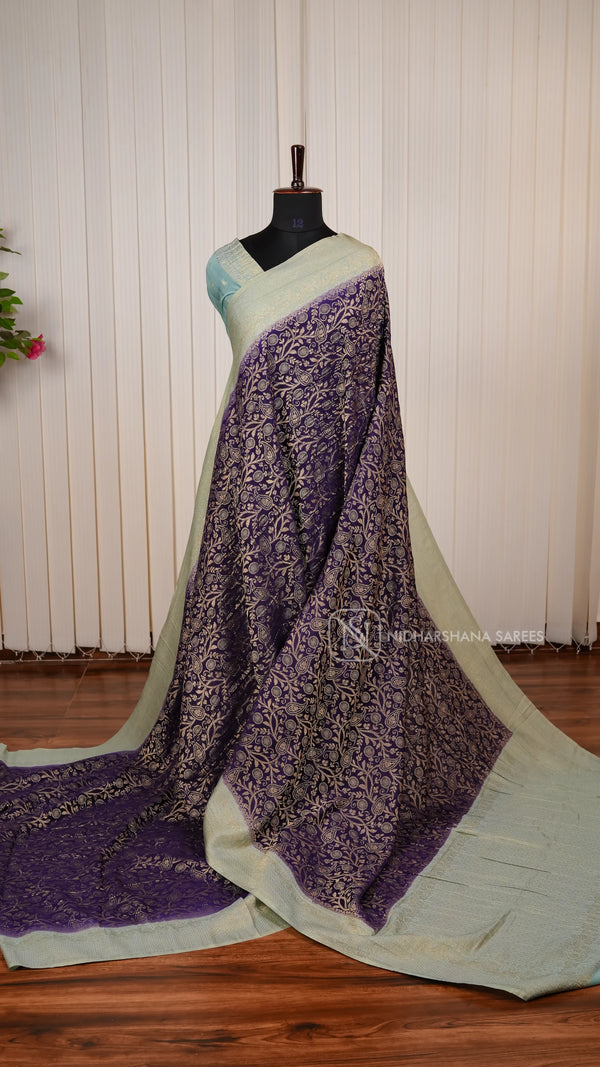 Crepe Georgette Saree With All-Over Floral Design And Elegant Zari Border Concept